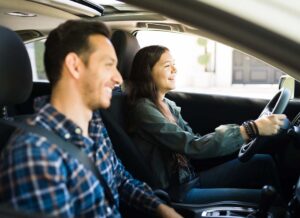 Happy and Smiling Dad With His Teenage Girl Practice Safe Driving Together in Preparation for Her Drivers License Test